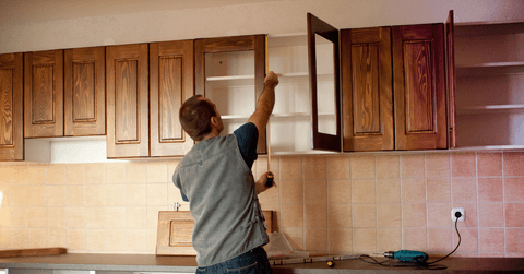 Carpenter working on new kitchen cabinets
