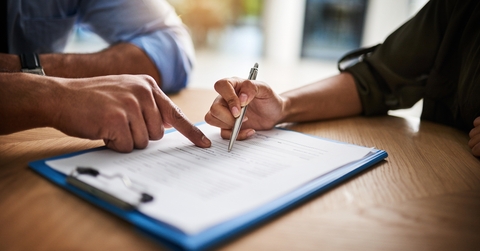 HR manager signing a contract