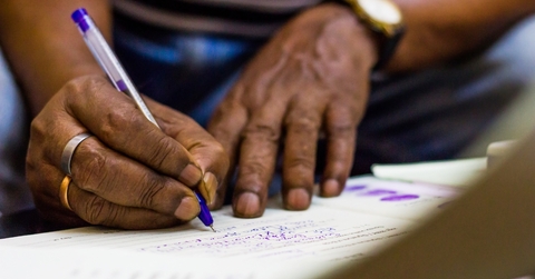 african american man signing important documents