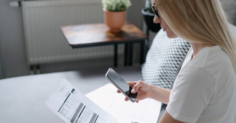 Woman scanning utility bill