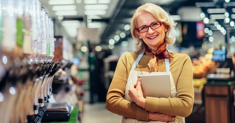 Owner standing in a grocery store