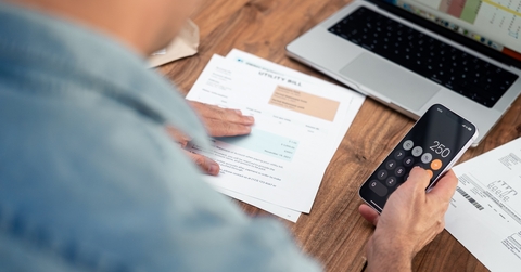 man using a smartphone calculator