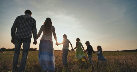 Family walking on the floor at sunset