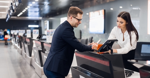 businessman in suit holding his passport