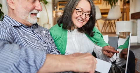 senior couple have fun online shopping