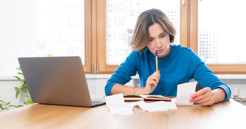 shocked woman sitting at the table