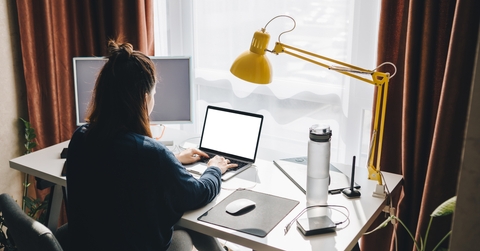woman working on laptop at home