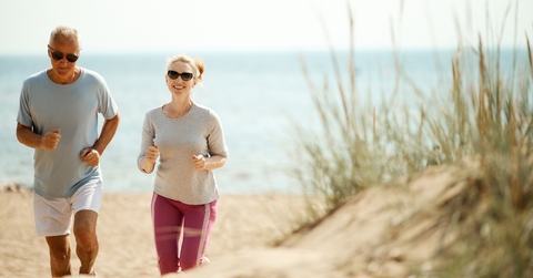cheerful and active couple retired spouses jogging in the morning