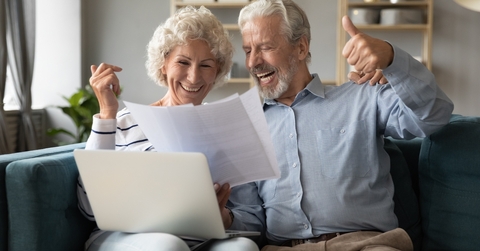 spouses check documents feels happy about pay debt off