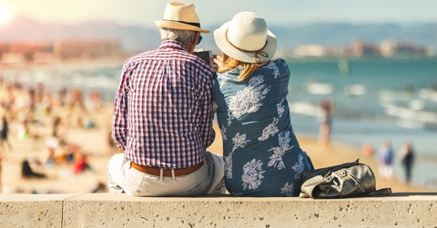 retired lovers enjoying retirement on the beach