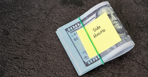 dollar bills and adhesive note