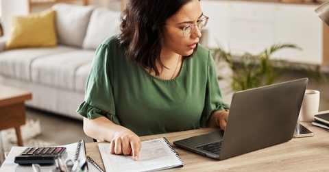 woman with laptop doing analysis