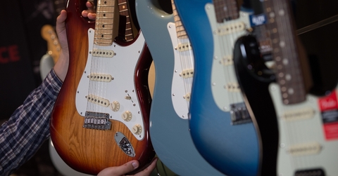 Many electric guitars hanging