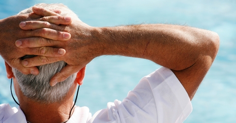senior man leaning on chair