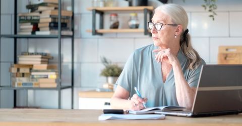 Senior woman using laptop for websurfing