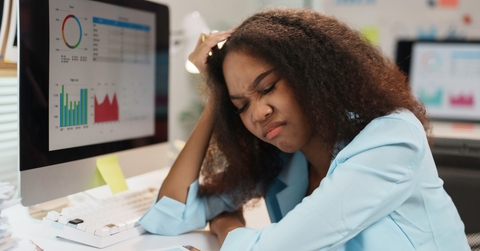 tired manager touching her head