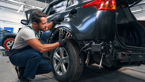 mechanic working on car
