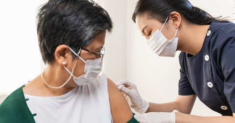 senior woman getting vaccinated