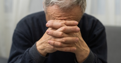 worried senior man praying