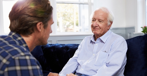 adult son talking to his father