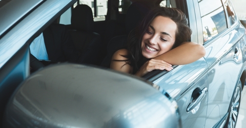 woman sitting in new vehicle