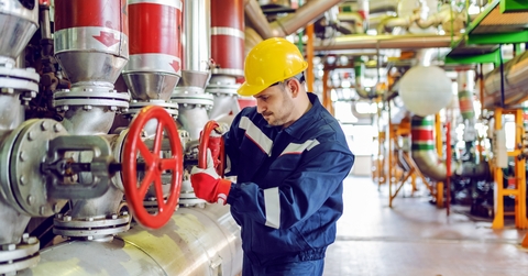 plant worker in protective suit