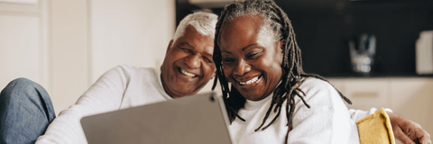 retired couple on tablet