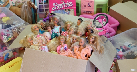 Barbie dolls packed in a cardboard box