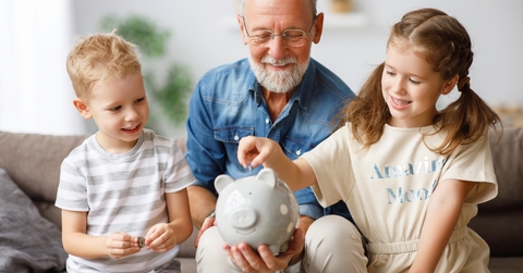 grandfather helping grandchildren 