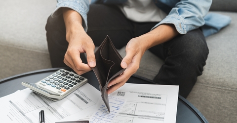 man opening an empty wallet
