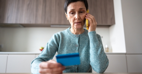 woman sending money to fraudsters