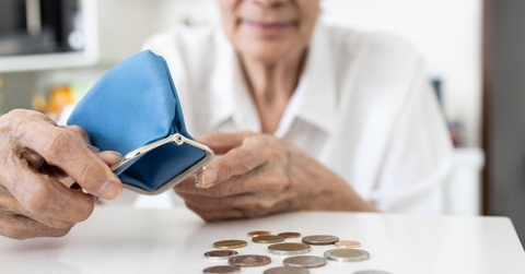 senior woman with her coins