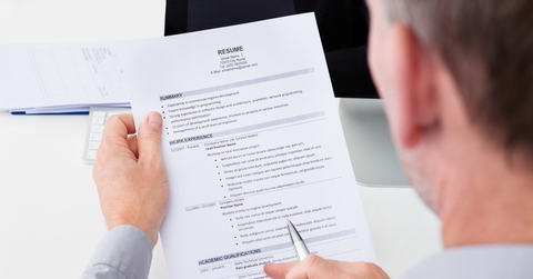 Man Holding Curriculum Vitae