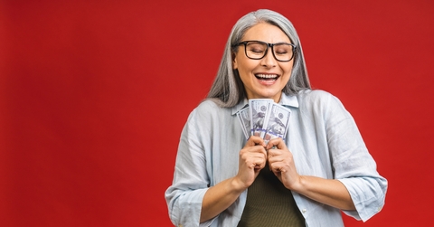 old woman holding money