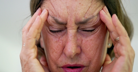 A senior woman stressed