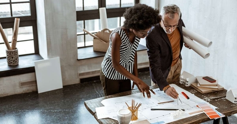 assistant of interior designer helping boss