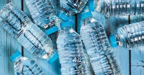 bottles of water on a wooden table
