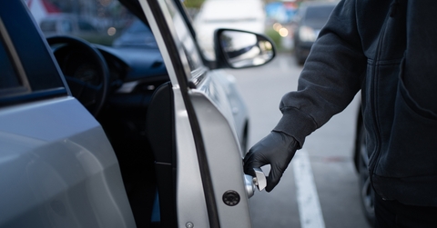 thief opening car door