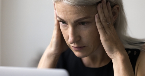 stressed woman working using laptop