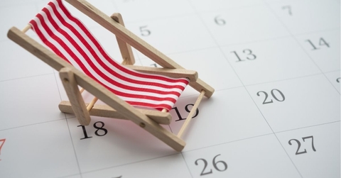 Red beach chair on white blank calendar background copy space. 