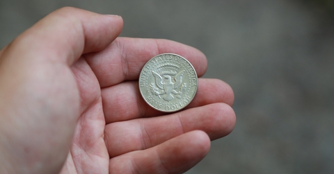 old coin half dollar in hand