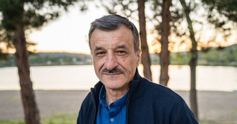 Close up of cheerful male standing looking to the camera