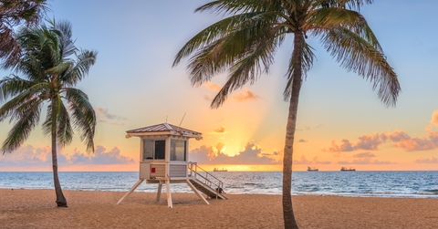 beach and life guard tower at sunrise