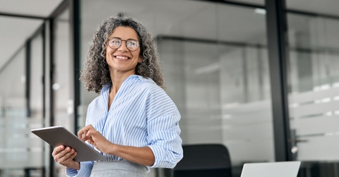 business woman holding tablet in office