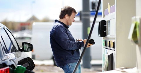 man filling gasoline fuel