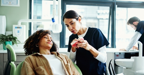 dentist explaining to her patient
