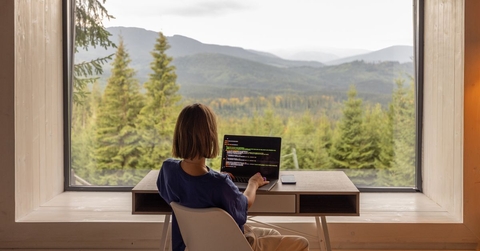 woman working remotely with picturesque view