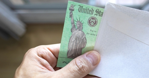a person holding a us treasury tax refund