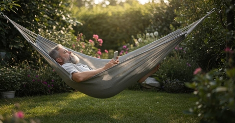 Man relaxes in hammock