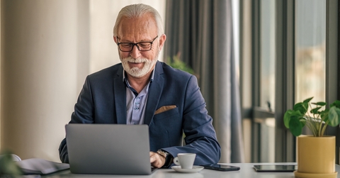senior businessman working on laptop